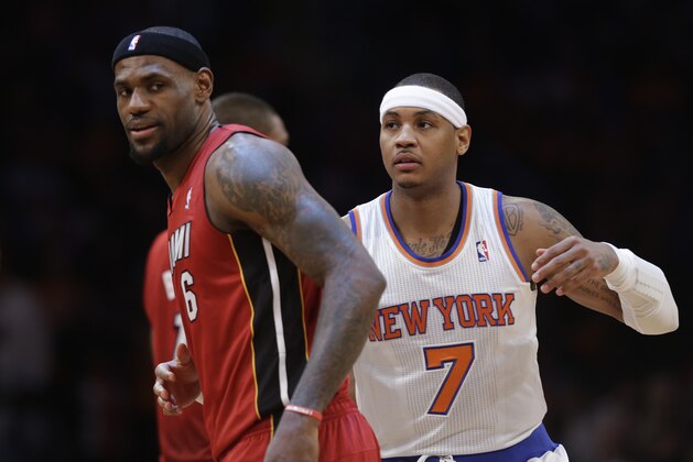 Miami Heat forward LeBron James (6) is shown with New York Knicks forward Carmelo Anthony (7) before their NBA basketball game at Madison Square Garden in New York, Sunday, March 3, 2013.  (AP Photo/Kathy Willens)