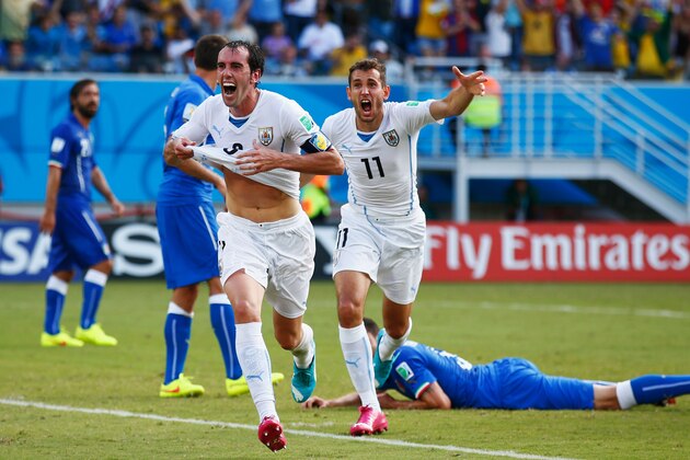 NATAL, BRAZIL - JUNE 24:  Diego Godin of Uruguay celebrates scoring his team's first goal during the 2014 FIFA World Cup Brazil Group D match between Italy and Uruguay at Estadio das Dunas on June 24, 2014 in Natal, Brazil.  (Photo by Clive Rose/Getty Images)