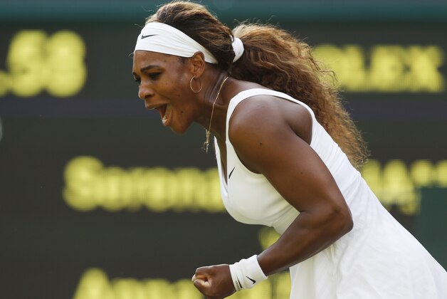 Serena Williams of U.S.  celebrates after winning a point against Anna Tatishvili of U.S. in their match at the All England Lawn Tennis Championships in Wimbledon, London, Tuesday, June 24, 2014. (AP Photo/Sang Tan)