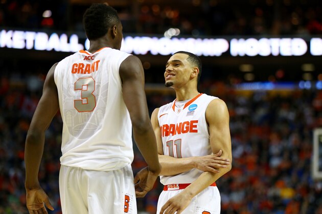 BUFFALO, NY - MARCH 22:  Jerami Grant #3 and Tyler Ennis #11 of the Syracuse Orange celebrate during the third round of the 2014 NCAA Men's Basketball Tournament against the Dayton Flyers at the First Niagara Center on March 22, 2014 in Buffalo, New York.  (Photo by Elsa/Getty Images)