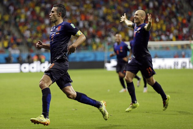Netherlands' Robin van Persie celebrates with teammate Arjen Robben, right,  after his scoring his side's fourth goal during the second half of the group B World Cup soccer match between Spain and the Netherlands at the Arena Ponte Nova in Salvador, Brazil, Friday, June 13, 2014.  (AP Photo/Natacha Pisarenko)