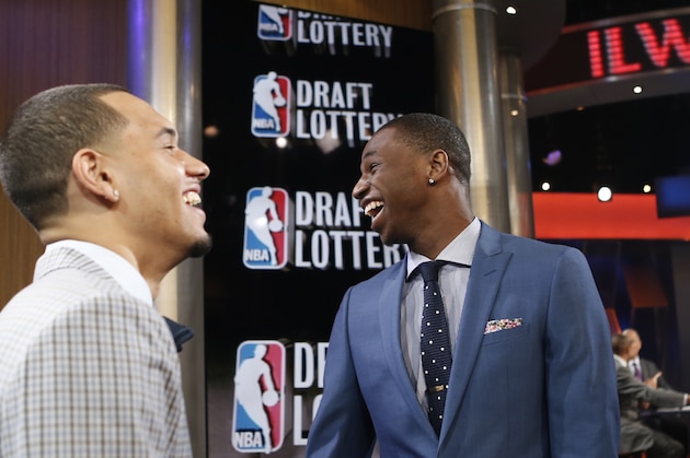 NBA draft prospects Tyler Ennis of Syracuse, left, and Andrew Wiggins of Kansas laugh before the NBA basketball draft lottery in New York, Tuesday, May 20, 2014.  (AP Photo/Kathy Willens)