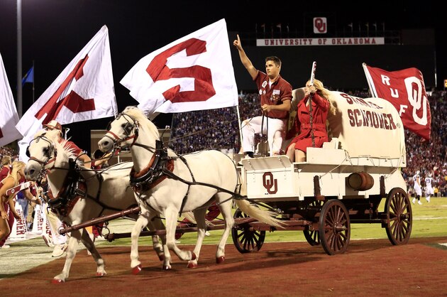 The Sooner Schooner and the Ruf Neks ride off the field after a Oklahoma touchdown against TCU during the second half of an NCAA college football game on Saturday, Oct. 5, 2013, in Norman, Okla. (AP Photo/Alonzo Adams)