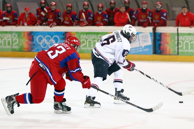 INNSBRUCK, AUSTRIA - JANUARY 20:  Maxim Lazarev of Russia battles with Nick Schmaltz of USA in the semi final match between USA and Russia in the Ice Hockey at the Tyrolean Ice Arena during the Winter Youth Olympic Game on January 20, 2012 in Innsbruck, Austria.  (Photo by Julian Finney/Getty Images)