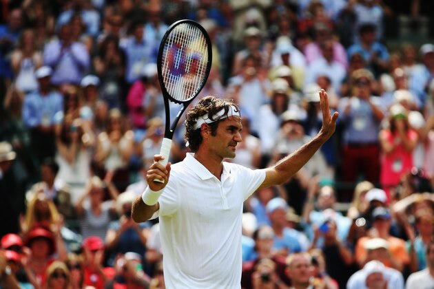 LONDON, ENGLAND - JUNE 24:  Roger Federer of Switzerland celebrates after defeating his Gentlemen's Singles first round match against Paolo Lorenzi of Italy on day two of the Wimbledon Lawn Tennis Championships at the All England Lawn Tennis and Croquet Club at Wimbledon on June 24, 2014 in London, England.  (Photo by Jan Kruger/Getty Images)