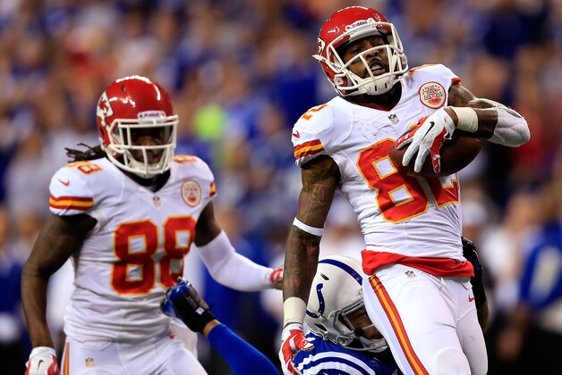 INDIANAPOLIS, IN - JANUARY 04: Wide receiver Dwayne Bowe #82 of the Kansas City Chiefs runs with the ball as strong safety Antoine Bethea #41 of the Indianapolis Colts defends during a Wild Card Playoff game at Lucas Oil Stadium on January 4, 2014 in Indianapolis, Indiana.  (Photo by Rob Carr/Getty Images)