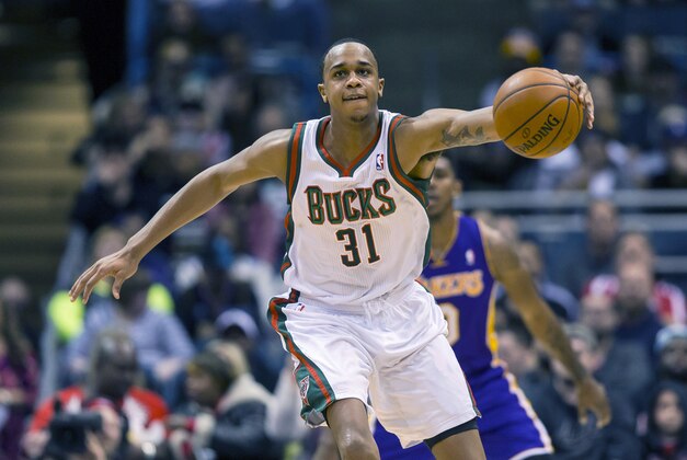 Mar 27, 2014; Milwaukee, WI, USA; Milwaukee Bucks center John Henson (31) grabs the loose ball during the second quarter against the Los Angeles Lakers at BMO Harris Bradley Center. Mandatory Credit: Jeff Hanisch-USA TODAY Sports