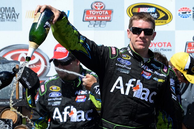 SONOMA, CA - JUNE 22:  Carl Edwards, driver of the #99 Aflac Ford, celebrates in victory lane after winning the NASCAR Sprint Cup Series Toyota/Save Mart 350 at Sonoma Raceway on June 22, 2014 in Sonoma, California.  (Photo by Robert Laberge/Getty Images)
