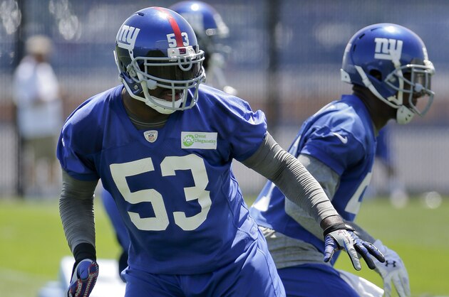 New York Giants inside linebacker Jameel McClain (53) moves back on defense during drills at NFL football minicamp, Wednesday, June 18, 2014, in East Rutherford, N.J. (AP Photo/Julie Jacobson)