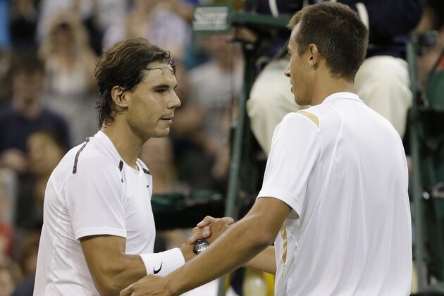 Lukas Rosol, right, of the Czech Republic is congratulated by Rafael Nadal of Spain after Rosol defeated Nadal in a second round men's singles match at the All England Lawn Tennis Championships at Wimbledon, England, Thursday, June 28, 2012. (AP Photo/Anja Niedringhaus)