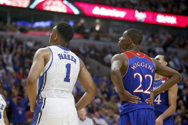 Duke forward Jabari Parker (1) and Kansas guard Andrew Wiggins (22) wait for a free throw during the second half of an NCAA college basketball game Tuesday, Nov. 12, 2013, in Chicago. Kansas won 94-83. (AP Photo/Charles Rex Arbogast)