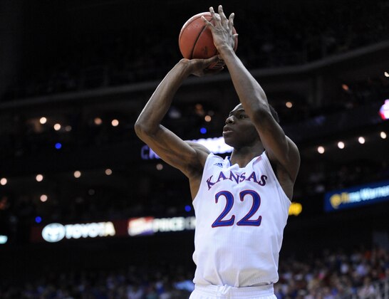 eMar 13, 2014; Kansas City, MO, USA; Kansas Jayhawks guard Andrew Wiggins (22) shoots a jumpshot during the second half against the Oklahoma State Cowboys in the second round of the Big 12 Conference college basketball tournament at Sprint Center. Kansas won 77-70 in overtime. Mandatory Credit: Denny Medley-USA TODAY Sports