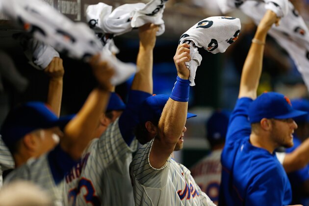 NEW YORK, NY - JUNE 24:  Members of the New York Mets wave towels after Chris Young #1 (not pictured) hits a solo home run in the fifth inning against the Oakland Athletics at Citi Field on June 24, 2014 in the Flushing neighborhood of the Queens borough of New York City.  (Photo by Mike Stobe/Getty Images)