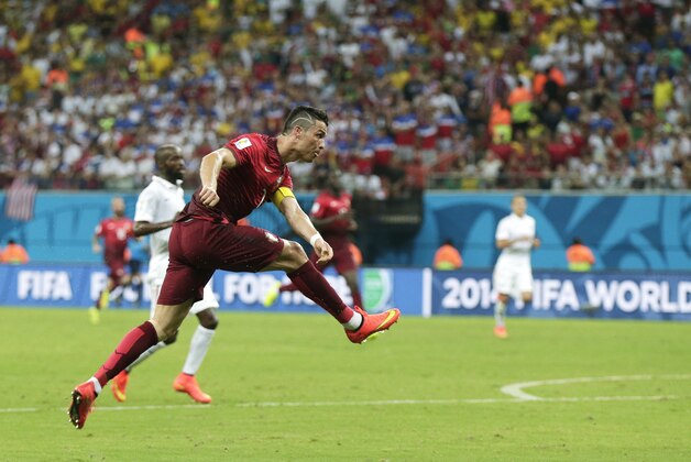 Portugal's Cristiano Ronaldo takes a shot during the group G World Cup soccer match between the United States and Portugal at the Arena da Amazonia in Manaus, Brazil, Sunday, June 22, 2014. (AP Photo/Marcio Jose Sanchez)