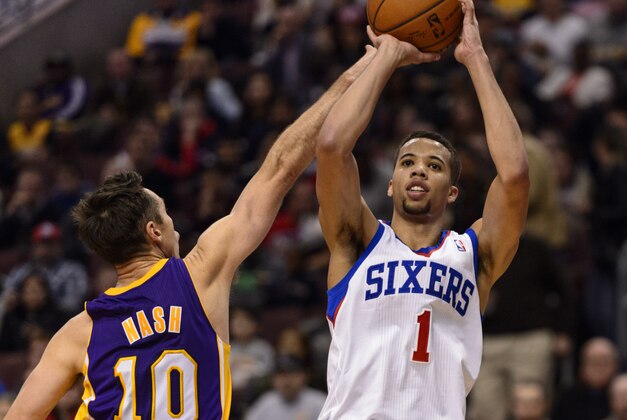 Feb 7, 2014; Philadelphia, PA, USA; Philadelphia 76ers guard Michael Carter-Williams (1) shoots under pressure from Los Angeles Lakers guard Steve Nash (10) during the third quarter at the Wells Fargo Center. The Lakers defeated the Sixers 112-98. Mandatory Credit: Howard Smith-USA TODAY Sports