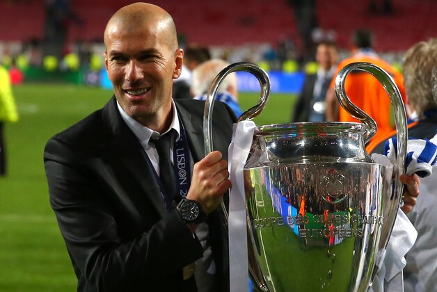 Former player Zinedine Zidane lifts the Champion League trophy, at the end of the Champions League final soccer match between Atletico Madrid and Real Madrid in Lisbon, Portugal, Saturday, May 24, 2014. Real Madrid won 4-1. (AP Photo/Andres Kudacki) Former player Zinedine Zidane lifts the Champion League trophy, at the end of the Champions League final soccer match between Atletico Madrid and Real Madrid in Lisbon, Portugal, Saturday, May 24, 2014. Real Madrid won 4-1. (AP Photo/Andres Kudacki)