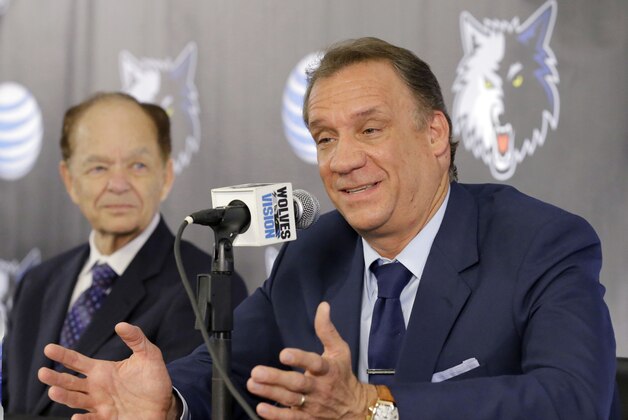Minnesota Timberwolves team president of basketball operations and new head coach Flip Saunders, right, responds to a question as team owner Glen Taylor, left, listens during a media availability in Minneapolis, Friday, June 6, 2014.  (AP Photo/Ann Heisenfelt)