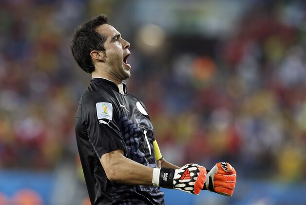 Chile's goalkeeper Claudio Bravo celebrates Chile's third goal by Jean Beausejour during the second half of the group B World Cup soccer match between Chile and Australia in the Arena Pantanal in Cuiaba, Brazil, Friday, June 13, 2014. (AP Photo/Thanassis Stavrakis)