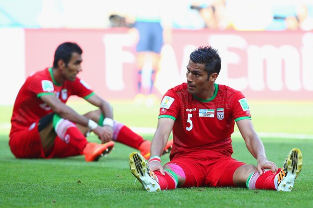 BELO HORIZONTE, BRAZIL - JUNE 21:  A dejected Amirhossein Sadeghi of Iran sits on the pitch after the 2014 FIFA World Cup Brazil Group F match between Argentina and Iran at Estadio Mineirao on June 21, 2014 in Belo Horizonte, Brazil.  (Photo by Paul Gilham/Getty Images)