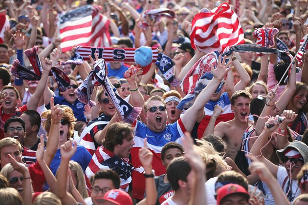 CHICAGO, IL - JUNE 22:  Fans in Grant Park celebrate a goal by the U.S. against Portugal in a Group G World Cup soccer match on June 22, 2014 in Chicago, Illinois. Fans were turned away from the free event after a 10,000-person capacity was reached.  (Photo by Scott Olson/Getty Images)
