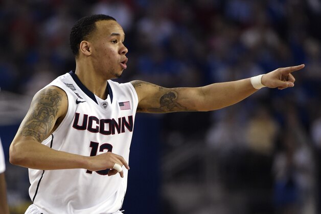 Apr 7, 2014; Arlington, TX, USA; Connecticut Huskies guard Shabazz Napier (13) reacts against the Kentucky Wildcats during the championship game of the Final Four in the 2014 NCAA Mens Division I Championship tournament at AT&T Stadium. Mandatory Credit: Robert Deutsch-USA TODAY Sports