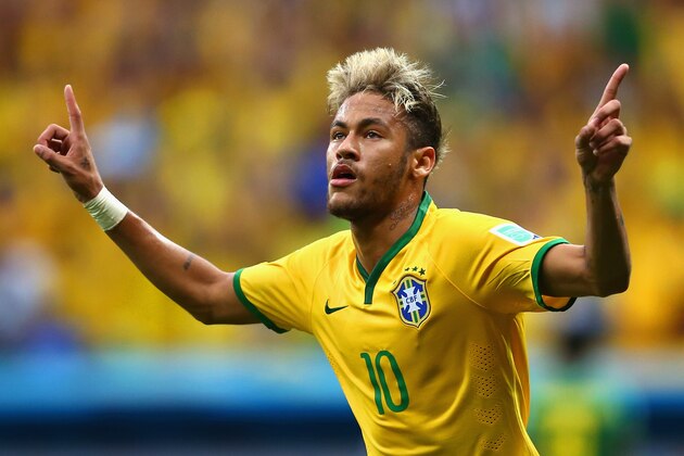 BRASILIA, BRAZIL - JUNE 23:  Neymar of Brazil celebrates scoring his team's second goal and his second of the game during the 2014 FIFA World Cup Brazil Group A match between Cameroon and Brazil at Estadio Nacional on June 23, 2014 in Brasilia, Brazil.  (Photo by Clive Brunskill/Getty Images)