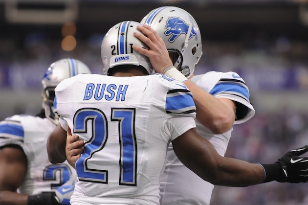MINNEAPOLIS, MN - DECEMBER 29: Reggie Bush #21 and Matthew Stafford #9 of the Detroit Lions celebrate a touchdown against the Minnesota Vikings during the third quarter of the game on December 29, 2013 at Mall of America Field at the Hubert H. Humphrey Metrodome in Minneapolis, Minnesota. The Vikings defeated the Lions 14-13. (Photo by Hannah Foslien/Getty Images)