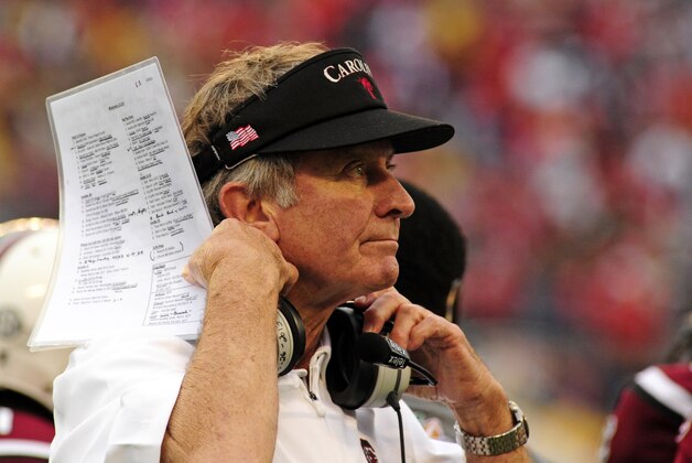 Jan 1, 2014; Orlando, FL, USA; South Carolina Gamecocks head coach Steve Spurrier puts on his headset as the South Carolina Gamecocks beat the Wisconsin Badgers 34-24 in the Capital One Bowl at Florida Citrus Bowl. Mandatory Credit: David Manning-USA TODAY Sports