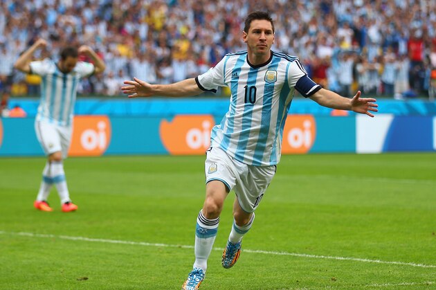 PORTO ALEGRE, BRAZIL - JUNE 25: Lionel Messi of Argentina celebrates scoring his team's first goal during the 2014 FIFA World Cup Brazil Group F match between Nigeria and Argentina at Estadio Beira-Rio on June 25, 2014 in Porto Alegre, Brazil.  (Photo by Paul Gilham/Getty Images)