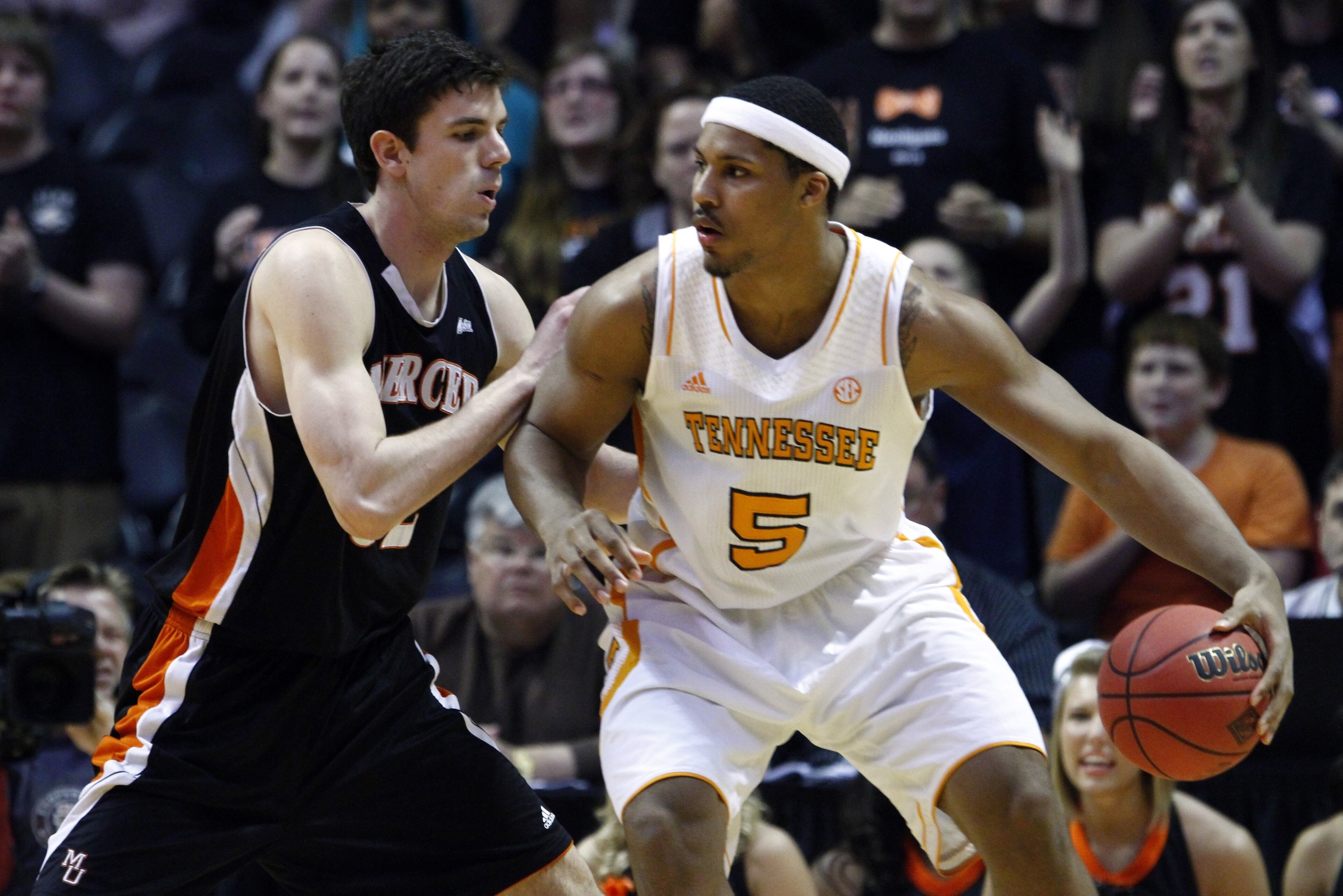 FILE -- In this March 20, 2013 file photo, Tennessee forward Jarnell Stokes (5) works against Mercer forward Daniel Coursey in the NIT college basketball tournament in Knoxville, Tenn. Stokes received some brutally honest feedback when he considered entering the NBA Draft after his sophomore season. He took that criticism to heart during the offseason by losing weight and developing a more well-rounded game. (AP Photo/Wade Payne, File)
