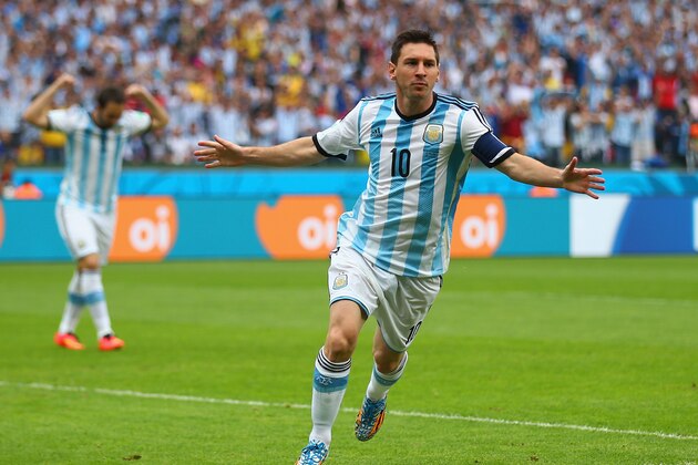 PORTO ALEGRE, BRAZIL - JUNE 25: Lionel Messi of Argentina celebrates scoring his team's first goal during the 2014 FIFA World Cup Brazil Group F match between Nigeria and Argentina at Estadio Beira-Rio on June 25, 2014 in Porto Alegre, Brazil.  (Photo by Paul Gilham/Getty Images)