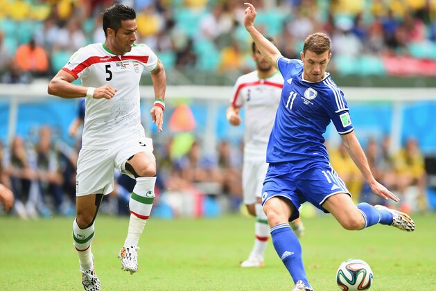 SALVADOR, BRAZIL - JUNE 25:  Edin Dzeko of Bosnia and Herzegovina shoots and scores his team's first goal during the 2014 FIFA World Cup Brazil Group F match between Bosnia and Herzegovina and Iran at Arena Fonte Nova on June 25, 2014 in Salvador, Brazil.  (Photo by Laurence Griffiths/Getty Images)