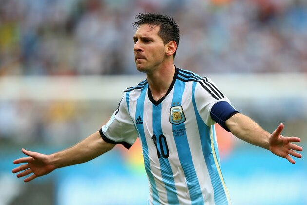 PORTO ALEGRE, BRAZIL - JUNE 25:  Lionel Messi of Argentina celebrates scoring his team's second goal and his second of the game during the 2014 FIFA World Cup Brazil Group F match between Nigeria and Argentina at Estadio Beira-Rio on June 25, 2014 in Porto Alegre, Brazil.  (Photo by Ian Walton/Getty Images)