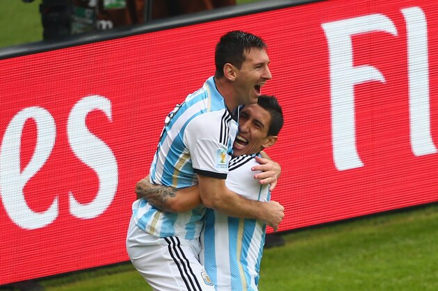 PORTO ALEGRE, BRAZIL - JUNE 25:  Lionel Messi of Argentina (L) celebrates scoring his team's first goal with Angel di Maria during the 2014 FIFA World Cup Brazil Group F match between Nigeria and Argentina at Estadio Beira-Rio on June 25, 2014 in Porto Alegre, Brazil.  (Photo by Quinn Rooney/Getty Images)