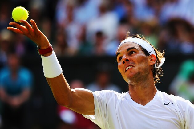 LONDON, ENGLAND - JUNE 24:  Rafael Nadal of Spain serves during his Gentlemen's Singles first round match against Martin Klizan of Slovakia on day two of the Wimbledon Lawn Tennis Championships at the All England Lawn Tennis and Croquet Club at Wimbledon on June 24, 2014 in London, England.  (Photo by Al Bello/Getty Images)