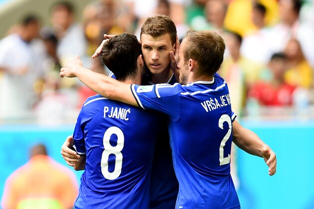 SALVADOR, BRAZIL - JUNE 25:  Edin Dzeko of Bosnia and Herzegovina (center) celebrates scoring his team's first goal during the 2014 FIFA World Cup Brazil Group F match between Bosnia and Herzegovina and Iran at Arena Fonte Nova on June 25, 2014 in Salvador, Brazil.  (Photo by Jamie McDonald/Getty Images)