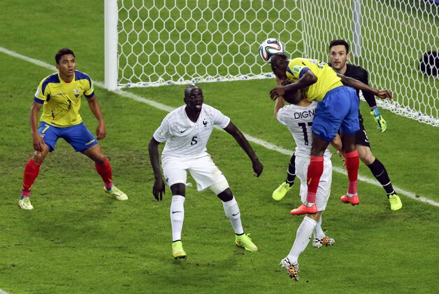 Ecuador's Enner Valencia (13) heads the ball towards the goal which is saved by France's goalkeeper Hugo Lloris in the first half during the group E World Cup soccer match between Ecuador and France at the Maracana Stadium in Rio de Janeiro, Brazil, Wednesday, June 25, 2014. (AP Photo/Andrew Medichini)