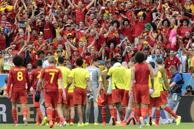Belgian players celebrate with their supporters after the group H World Cup soccer match between Belgium and Russia at the Maracana Stadium in Rio de Janeiro, Brazil, Sunday, June 22, 2014. Belgium won the match 1-0. (AP Photo/Ivan Sekretarev)