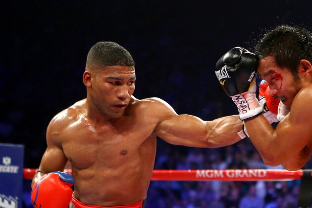 LAS VEGAS, NV - DECEMBER 08:  (L-R) Yuriorkis Gamboa connects with a left to the head of Michael Farenas during their super featherweight bout at the MGM Grand Garden Arena on December 8, 2012 in Las Vegas, Nevada.  (Photo by Al Bello/Getty Images)