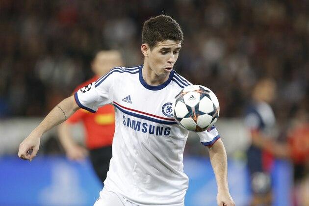 Chelsea's Oscar eyes the ball during the Champions League quarterfinal first leg soccer match between PSG and Chelsea, at the Parc des Princes stadium, in Paris, Wednesday, April 2, 2014. (AP Photo/Christophe Ena)