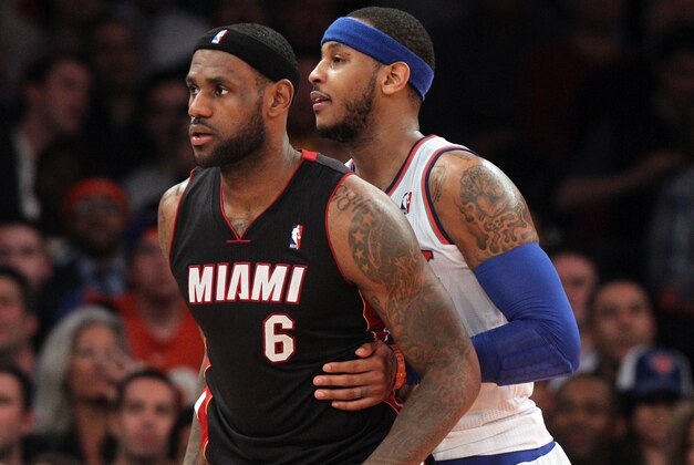 Jan 9, 2014; New York, NY, USA; New York Knicks small forward Carmelo Anthony (7) defends Miami Heat small forward LeBron James (6) during the fourth quarter of a game at Madison Square Garden. Mandatory Credit: Brad Penner-USA TODAY Sports