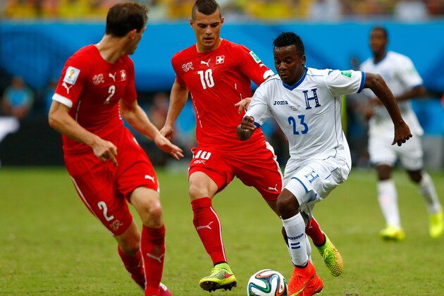 MANAUS, BRAZIL - JUNE 25:  Marvin Chavez of Honduras controls the ball as Granit Xhaka of Switzerland gives chase during the 2014 FIFA World Cup Brazil Group E match between Honduras and Switzerland at Arena Amazonia on June 25, 2014 in Manaus, Brazil.  (Photo by Matthew Lewis/Getty Images)