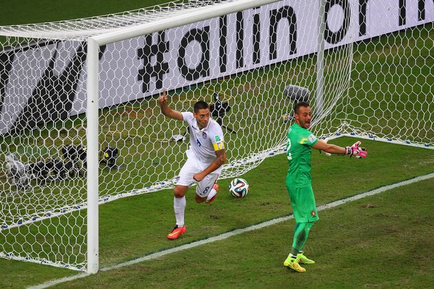 MANAUS, BRAZIL - JUNE 22: Clint Dempsey of the United States celebrates scoring his team's second goal past Beto of Portugal during the 2014 FIFA World Cup Brazil Group G match between the United States and Portugal at Arena Amazonia on June 22, 2014 in Manaus, Brazil.  (Photo by Elsa/Getty Images)