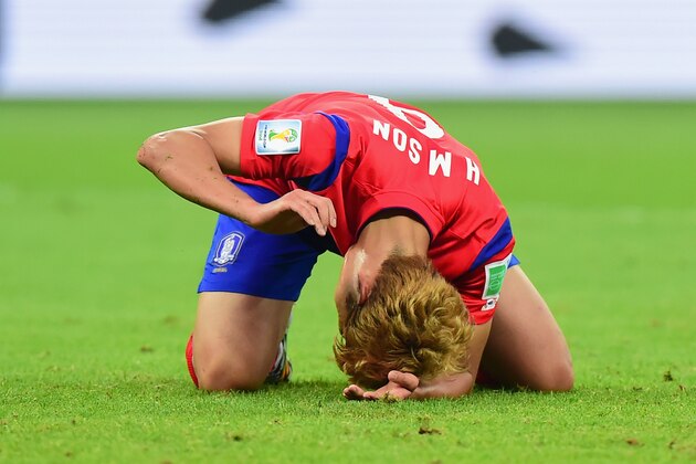 PORTO ALEGRE, BRAZIL - JUNE 22: Son Heung-Min of South Korea reacts after being defeated by Algeria 4-2 during the 2014 FIFA World Cup Brazil Group H match between South Korea and Algeria at Estadio Beira-Rio on June 22, 2014 in Porto Alegre, Brazil.  (Photo by Vinicius Costa/Getty Images)
