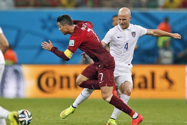 Portugal's Cristiano Ronaldo is tripped up by United States' Michael Bradley during the group G World Cup soccer match between the United States and Portugal at the Arena da Amazonia in Manaus, Brazil, Sunday, June 22, 2014. (AP Photo/Julio Cortez) Portugal's Cristiano Ronaldo is tripped up by United States' Michael Bradley during the group G World Cup soccer match between the United States and Portugal at the Arena da Amazonia in Manaus, Brazil, Sunday, June 22, 2014. (AP Photo/Julio Cortez)
