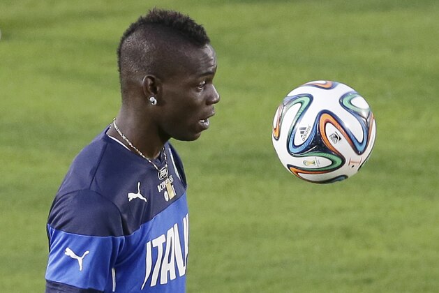 Italy's Mario Balotelli controls the ball during a training session of the Italian national soccer team in Natal, Brazil, Saturday, June 21, 2014. Italy proved ineffective in a 1-0 loss to Costa Rica on Friday and now the Azzurri need a win or a draw against Uruguay on Tuesday to reach the second round of the World Cup. (AP Photo/Antonio Calanni)