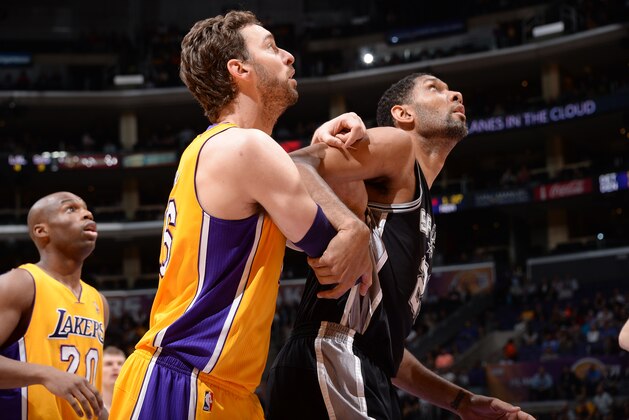 LOS ANGELES, CA - MARCH 19: Tim Duncan #21 of the San Antonio Spurs and Pau Gasol #16 the Los Angeles Lakers during a game at Staples Center on March 19, 2014 in Los Angeles, California. NOTE TO USER: User expressly acknowledges and agrees that, by downloading and/or using this Photograph, user is consenting to the terms and conditions of the Getty Images License Agreement. Mandatory Copyright Notice: Copyright 2014 NBAE (Photo by Andrew D. Bernstein/NBAE via Getty Images)