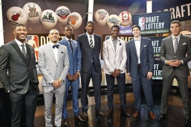 From left, NBA draft prospects Marcus Smart of Oklahoma State, Tyler Ennis of Syracuse, Andrew Wiggins and Joel Embiid of Kansas, Noah Vonleh of Indiana, Doug McDermott of Creighton and Aaron Gordon of Arizona pose for a photograph before the NBA basketball draft lottery in New York, Tuesday, May 20, 2014. (AP Photo/Kathy Willens)