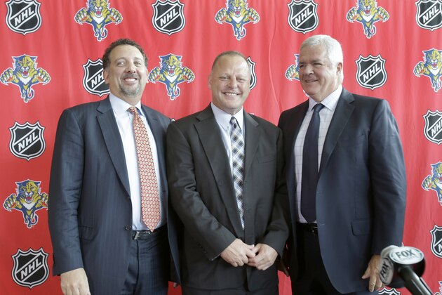 Gerard Gallant, center, newly named head coach of the Florida Panthers, poses for photos with Panthers' CEO and President Rory Babich, left, and General Manager and Executive Vice President Dale Tallon, right, after a news conference, Monday, June 23, 2014 in Sunrise, Fla. Gallant spent the last two seasons as an assistant with the Montreal Canadiens and saw there how quickly a team's fortunes can turn around. When he joined Montreal, the Canadiens were coming off a season where they finished last in the Eastern Conference. (AP Photo/Wilfredo Lee)