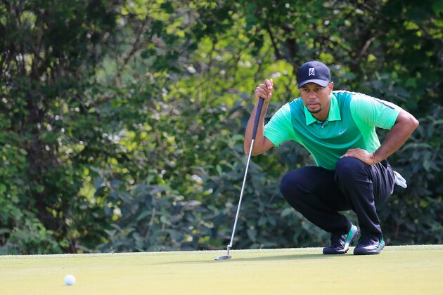 BETHESDA, MD - JUNE 26:  Tiger Woods of the United States studies his putt on the 16th hole during the first round of the Quicken Loans National at Congressional Country Club on June 26, 2014 in Bethesda, Maryland.  (Photo by Rob Carr/Getty Images)